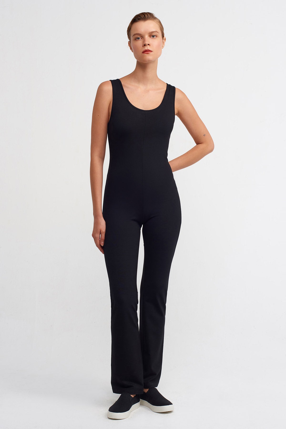 Naked Wardrobe sleeveless vinyl jumpsuit in black, £120.00